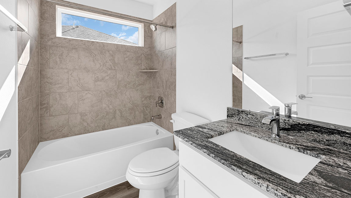 bathroom with a vanity sink, toilet and shower