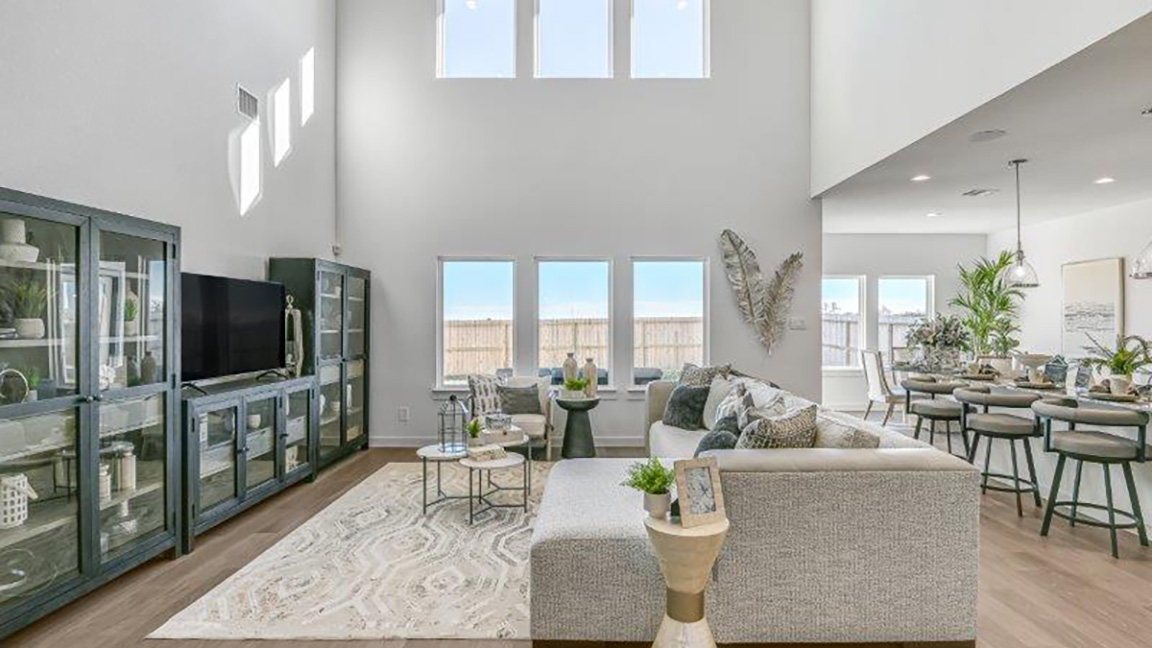 living room with tall windows