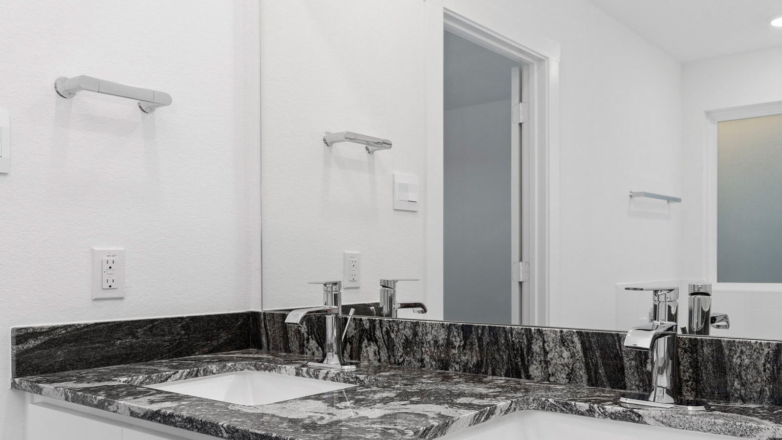 primary bathroom vanity with two sinks