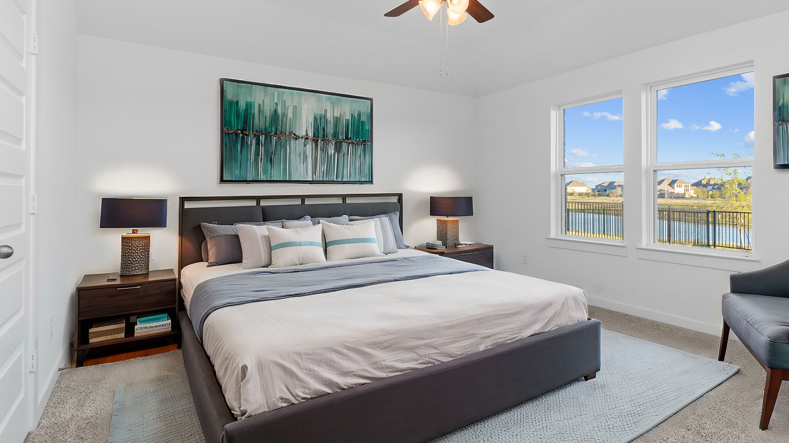 primary bedroom with with large window stagged