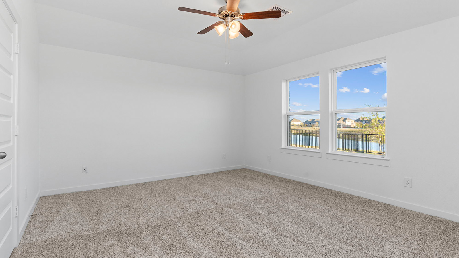 primary bedroom with with large window