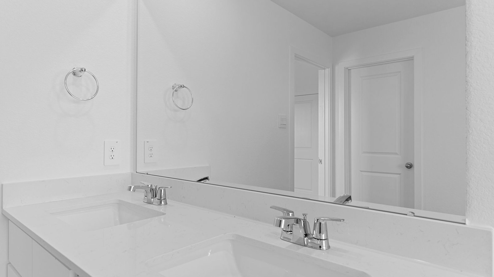 primary bathroom vanity with two sinks