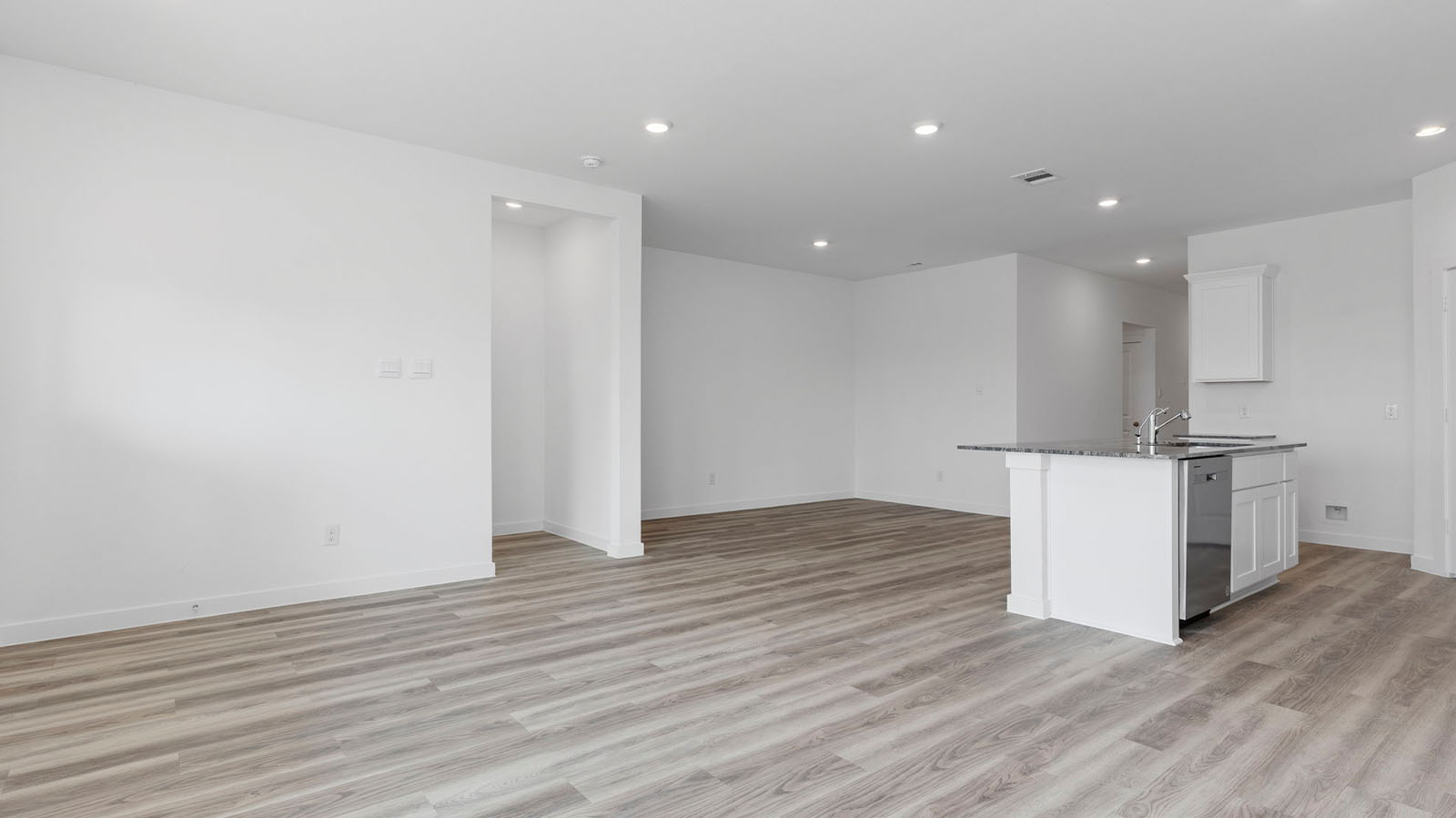 Open concept kitchen, dining, and living room