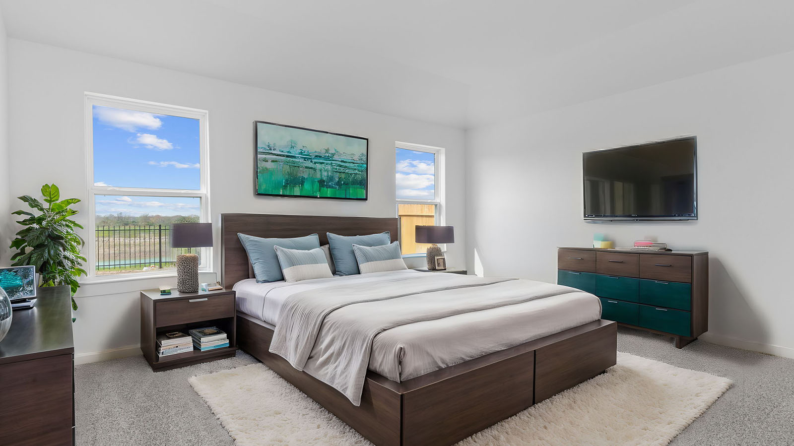 Primary bedroom with two large windows