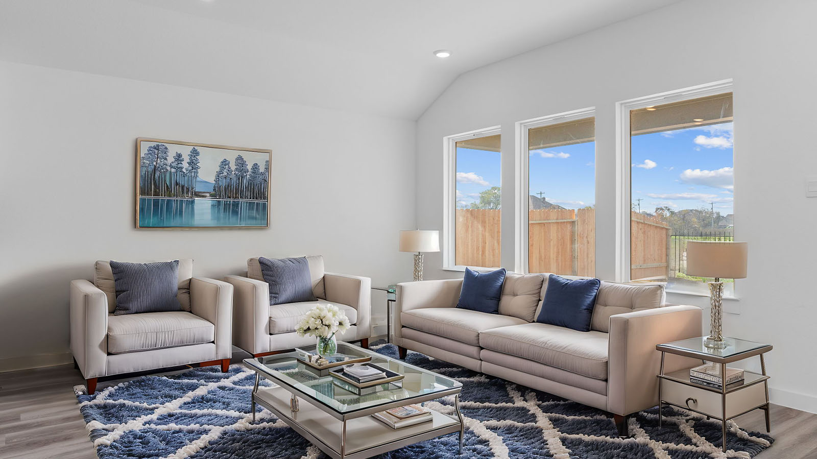 Spacious living room with three large windows