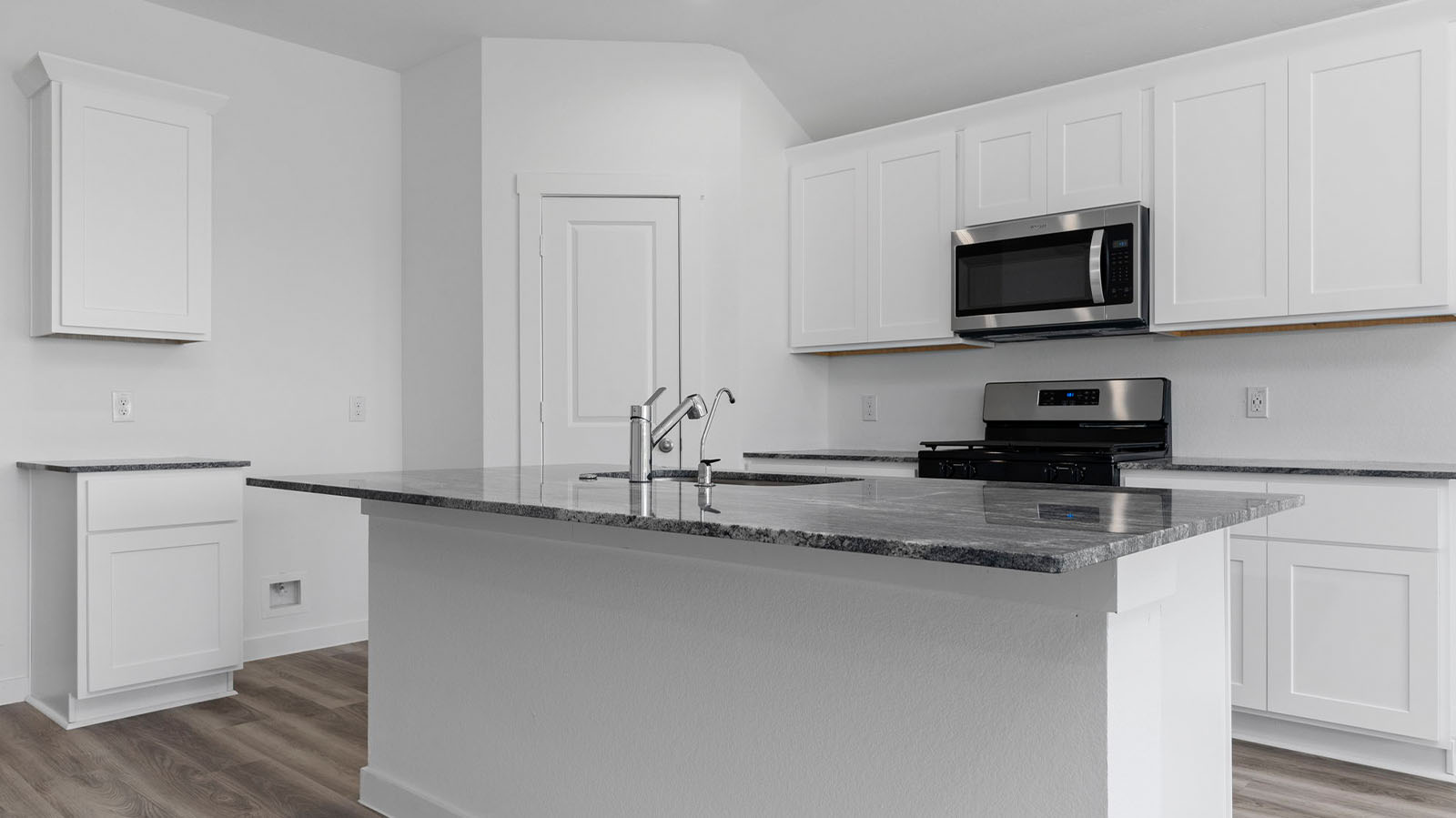 Kitchen with large kitchen island and a deep sink