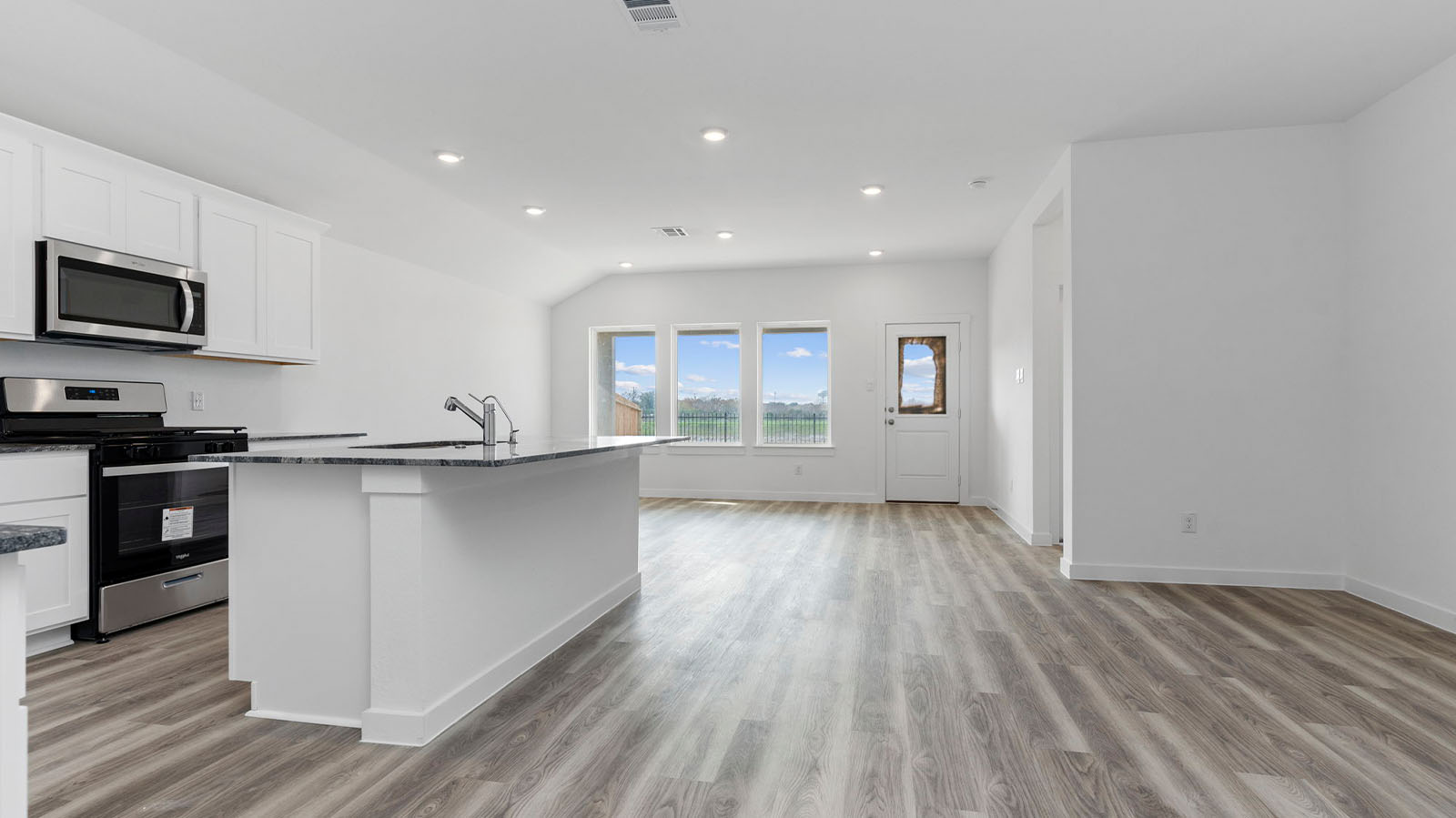 Open concept kitchen, dining, and living room