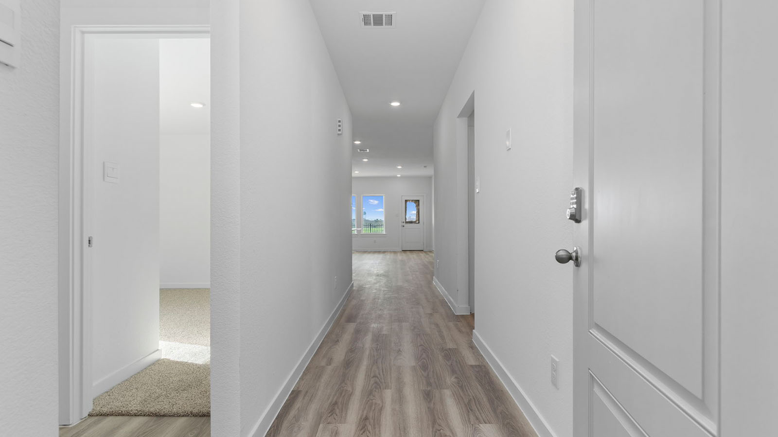 Entry way into the home leading to a hallway