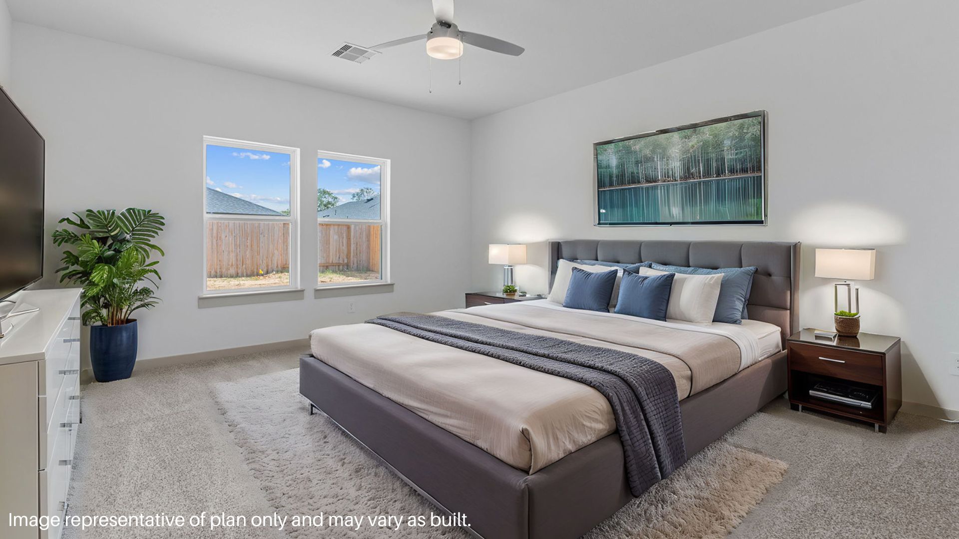 Primary bedroom with two large windows