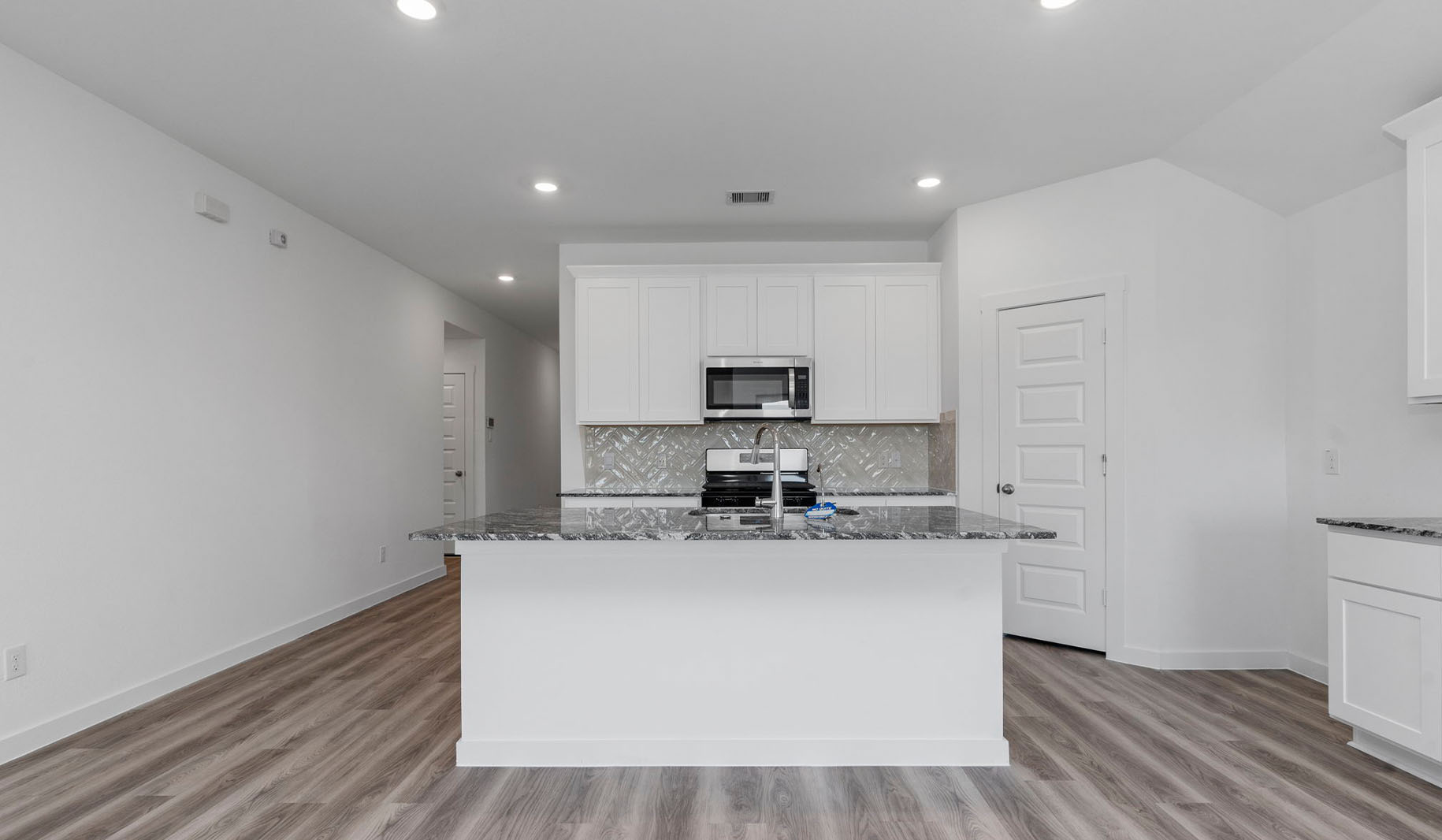 Kitchen with kitchen island and deep sink