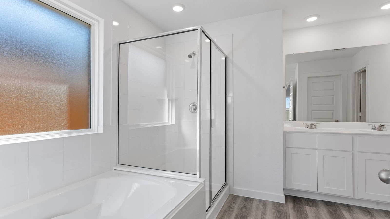 Primary bathroom with separate bathtub and shower