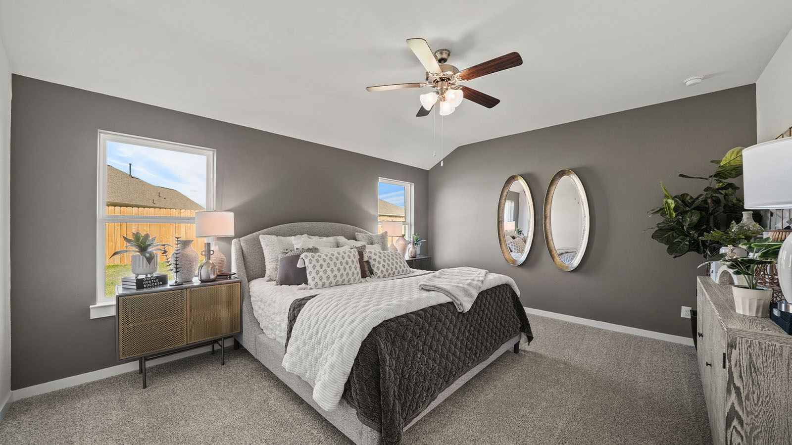 Primary bedroom with two large windows