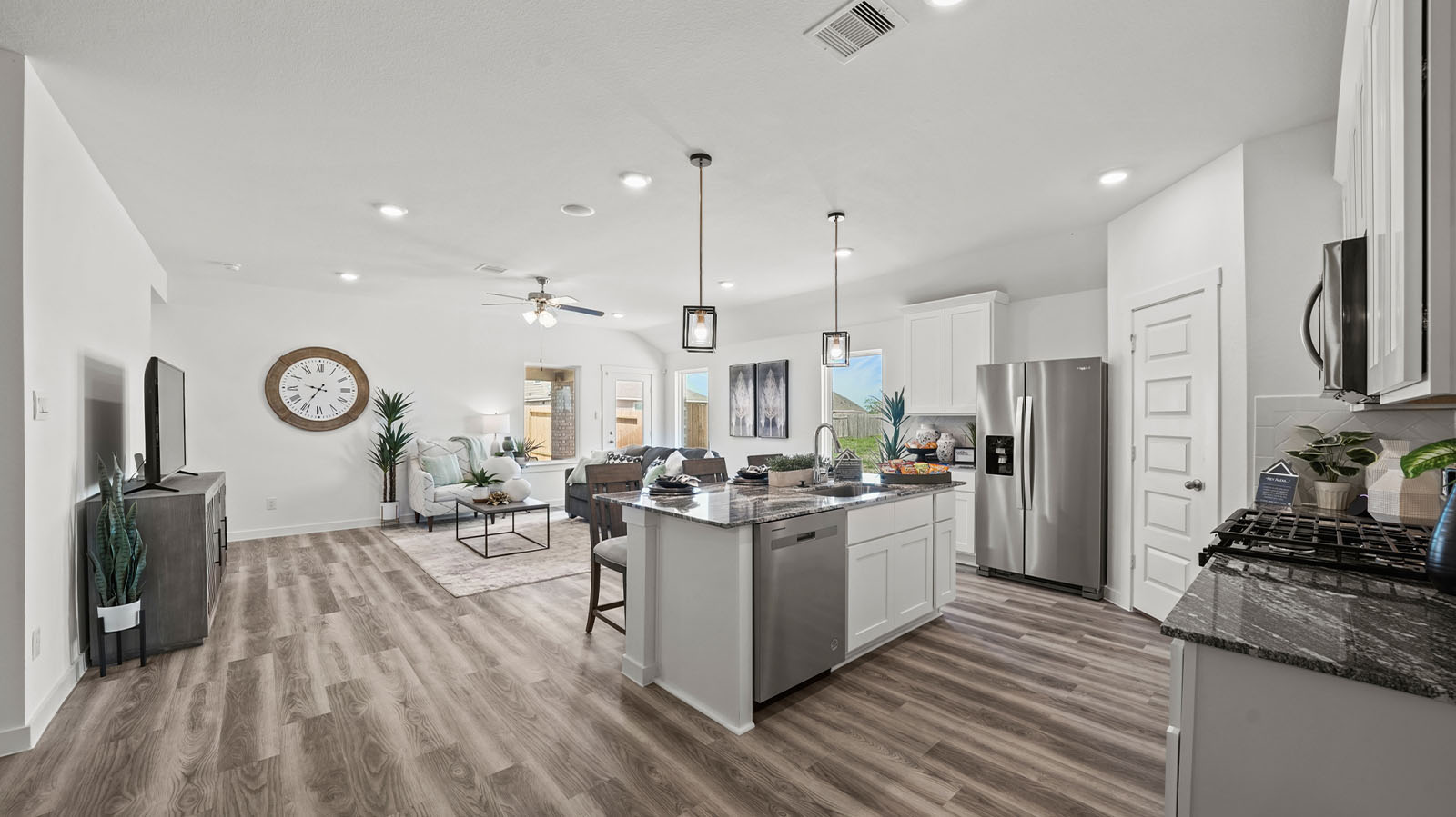 Open concept kitchen, dining, and living room.