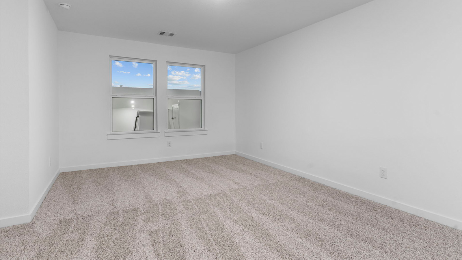 Upstairs game room with two large windows