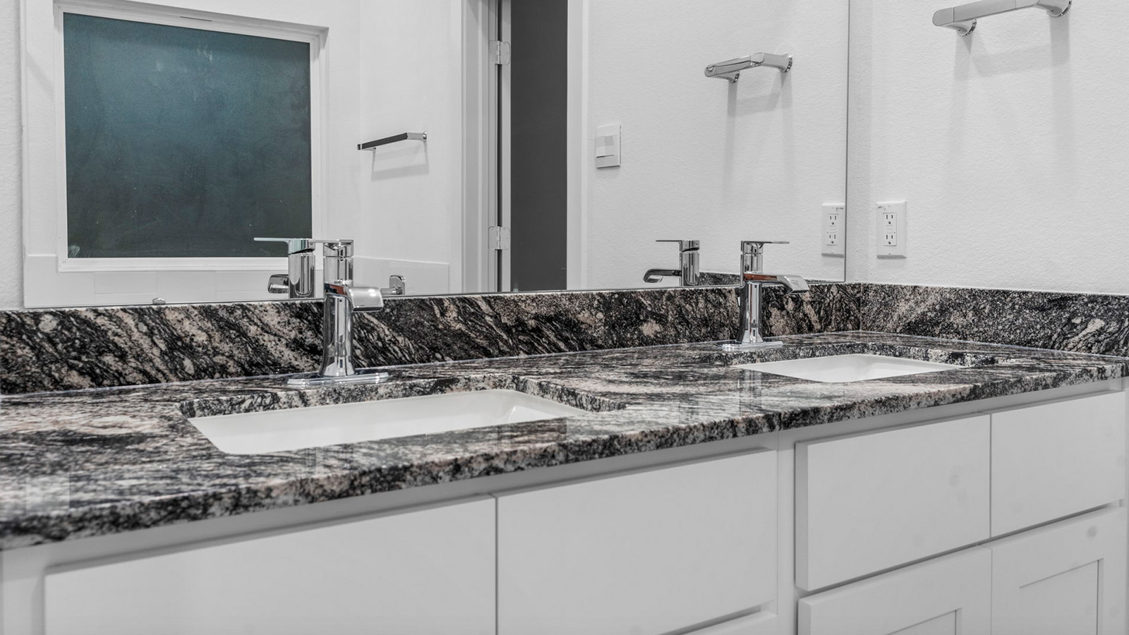 Primary bathroom vanity with two sinks