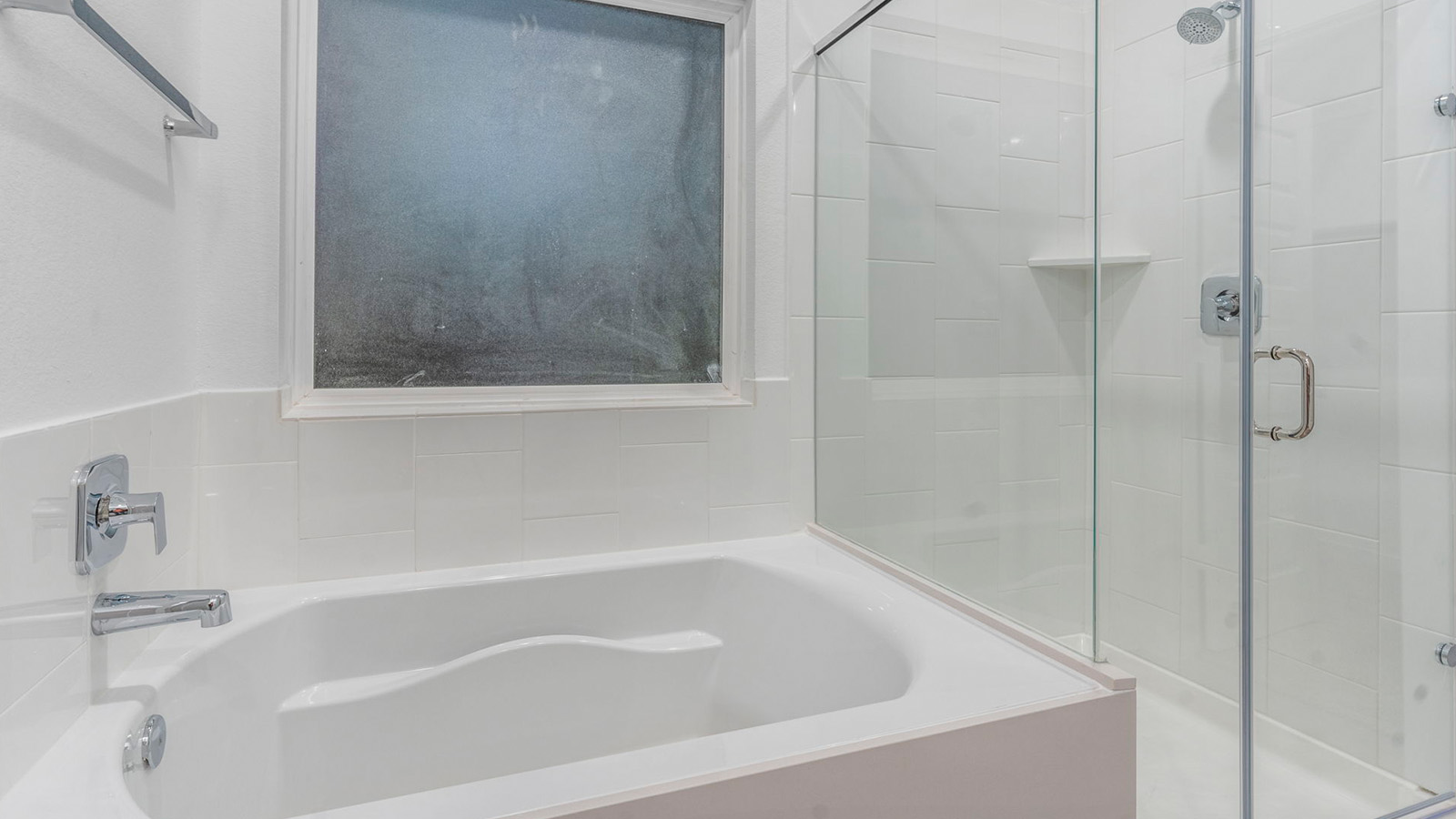 Primary bathroom with separate bathtub and shower