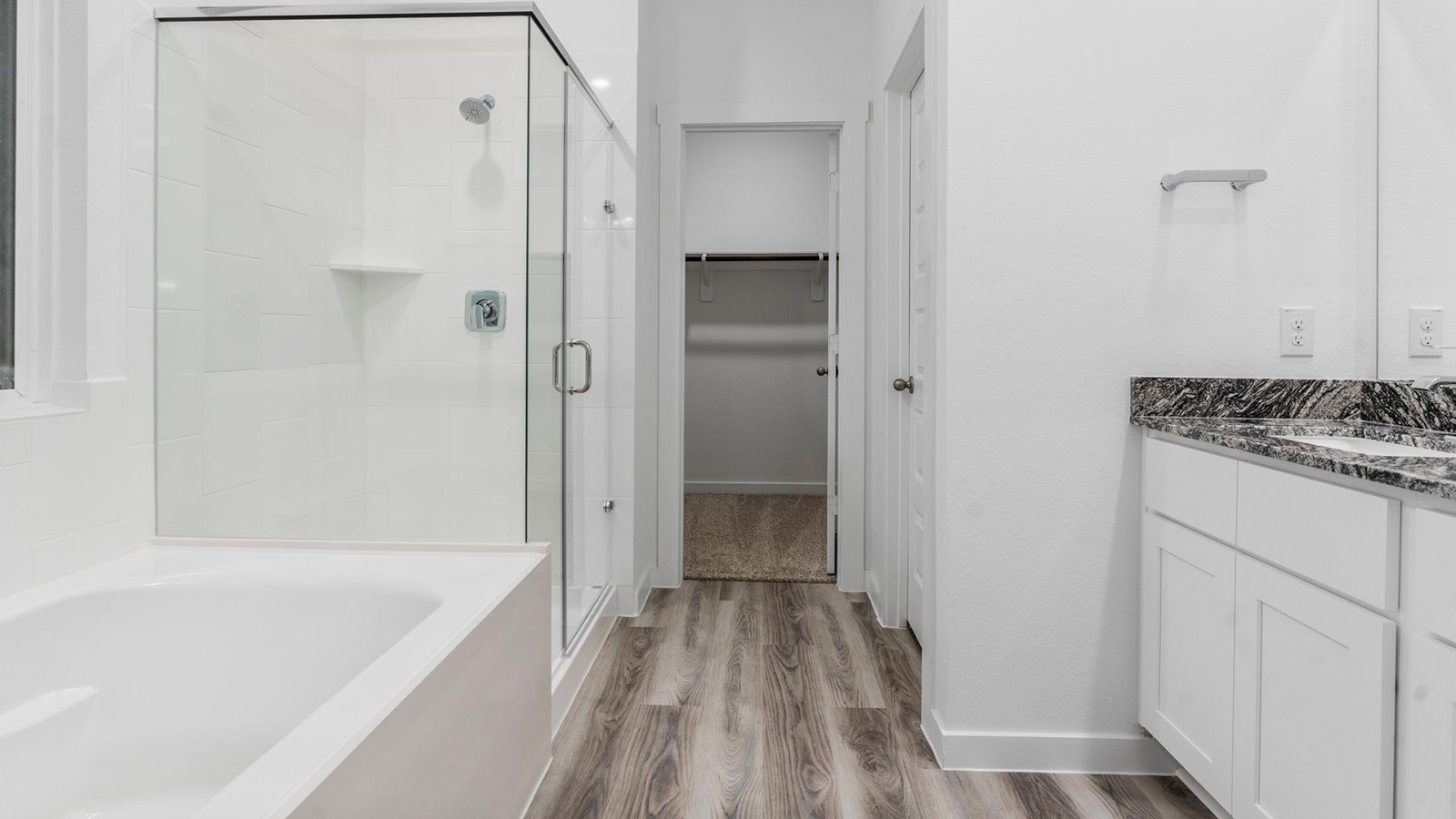 Primary bathroom with separate bathtub and shower