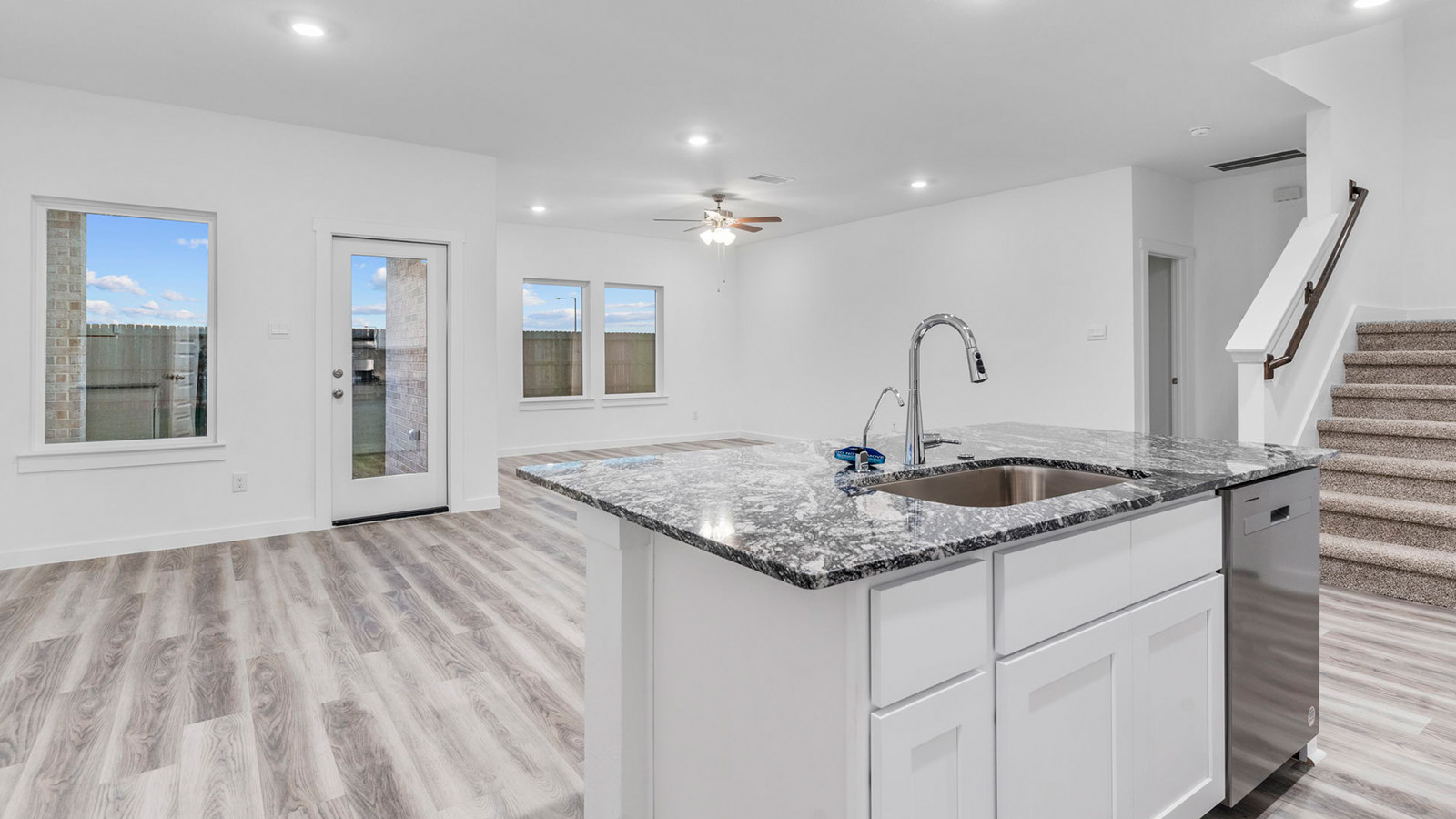 Open concept kitchen with large island and a deep sink
