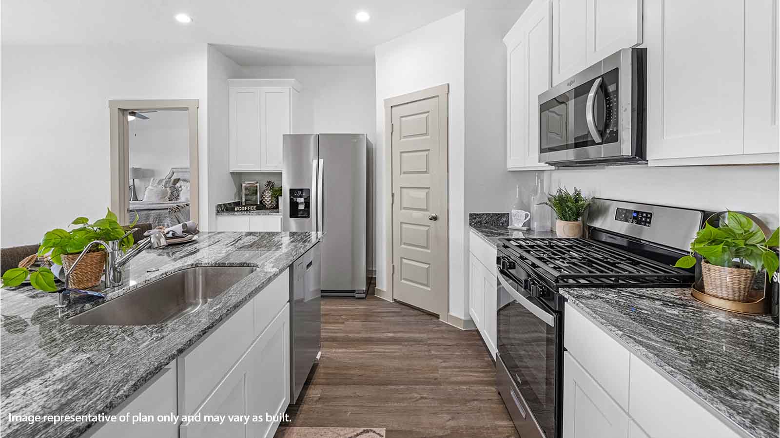 kitchen with white cabinetry, large island, and stainless steel appliances