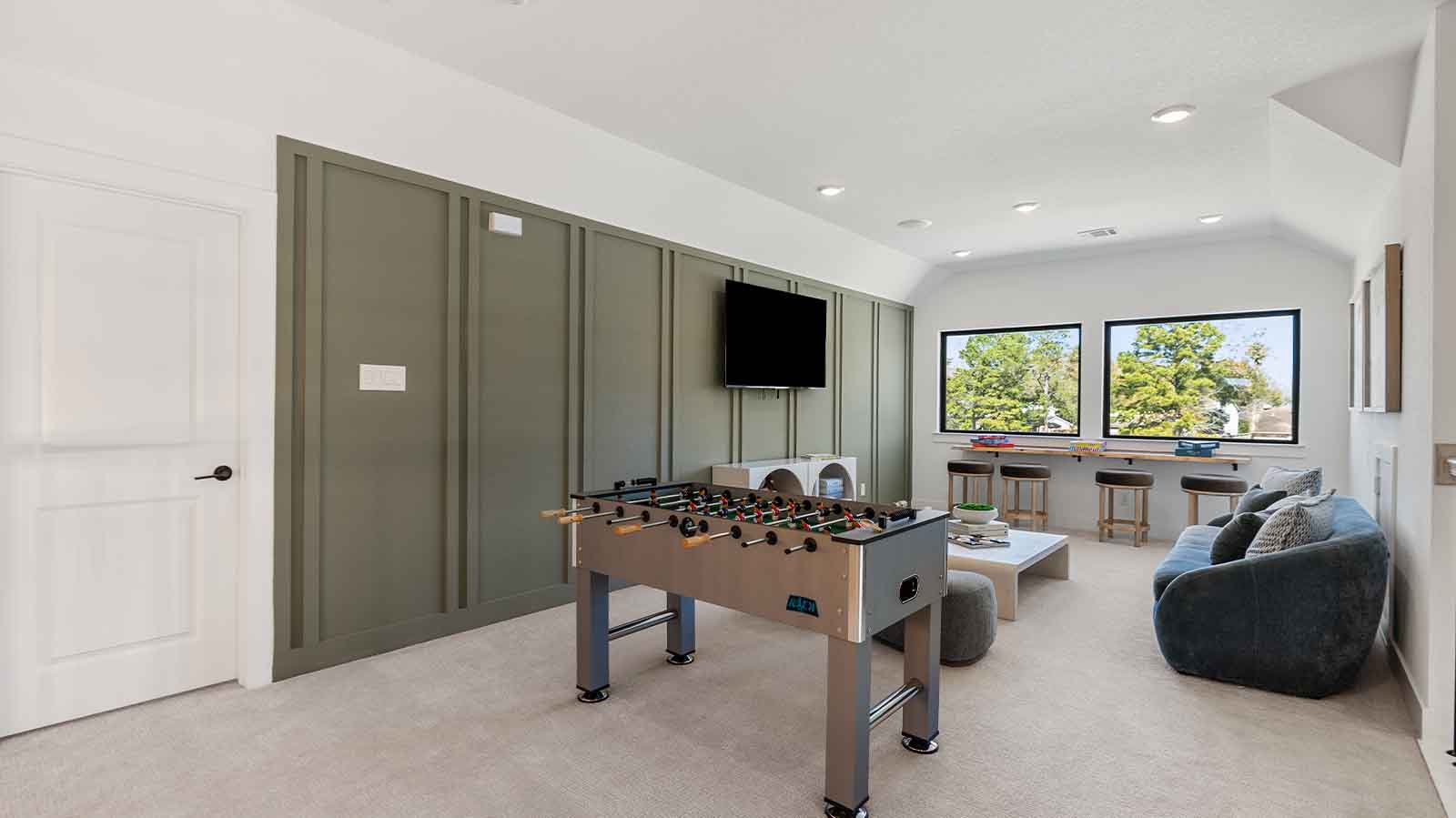 A spacious upstairs game room, great for additional entertainment for the whole family.