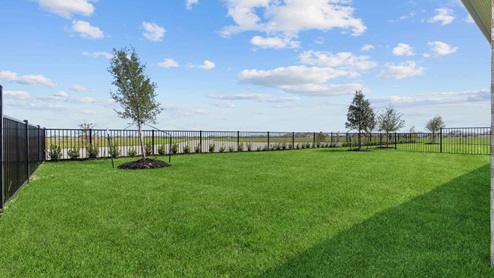 Backyard view from the covered patio and view of the lake
