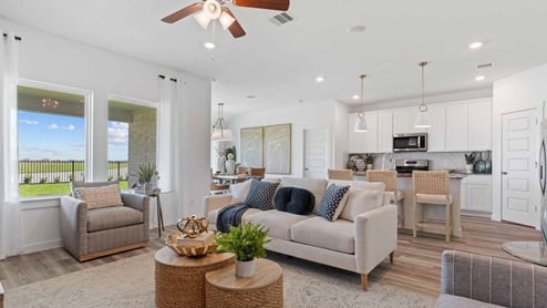 Living room with the view of the backyard through two large windows