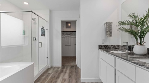 Primary bathroom with view of closet
