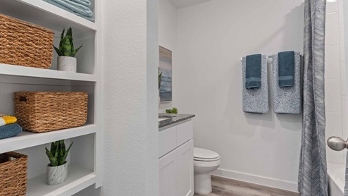 Secondary bathroom with open shelving