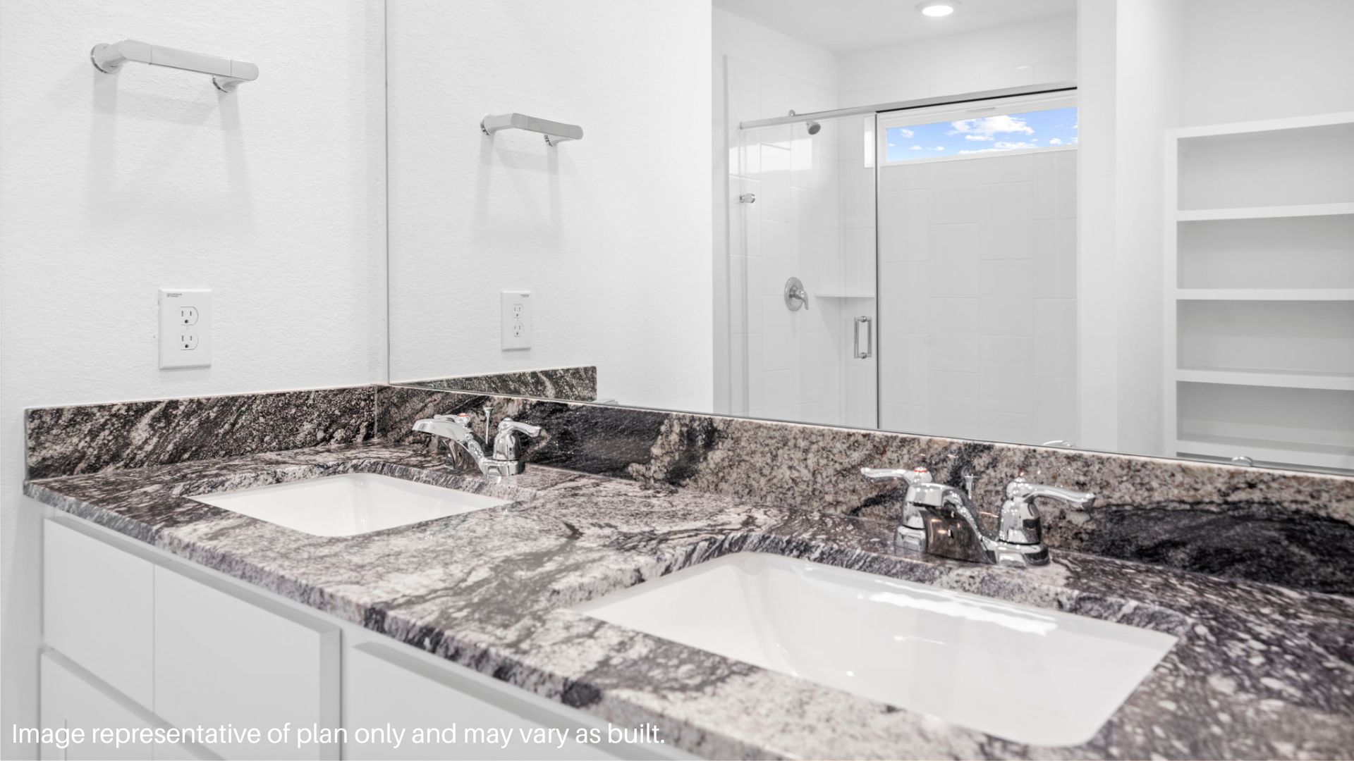 primary bathroom with stand alone shower and two sinks
