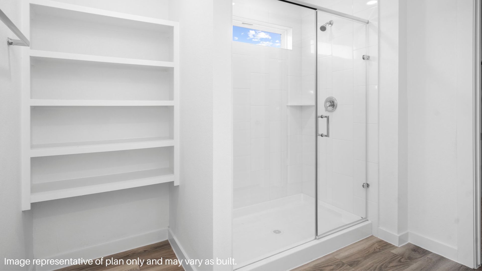 primary bathroom with stand alone shower and two sinks