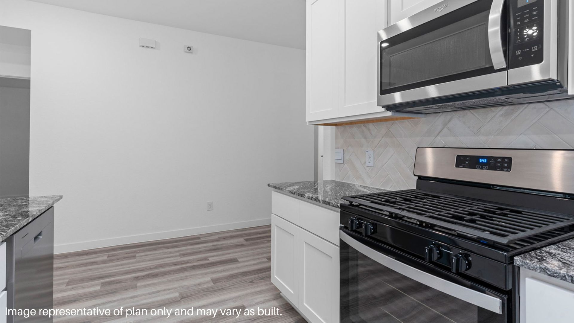 Kitchen with stainless steel apliances.
