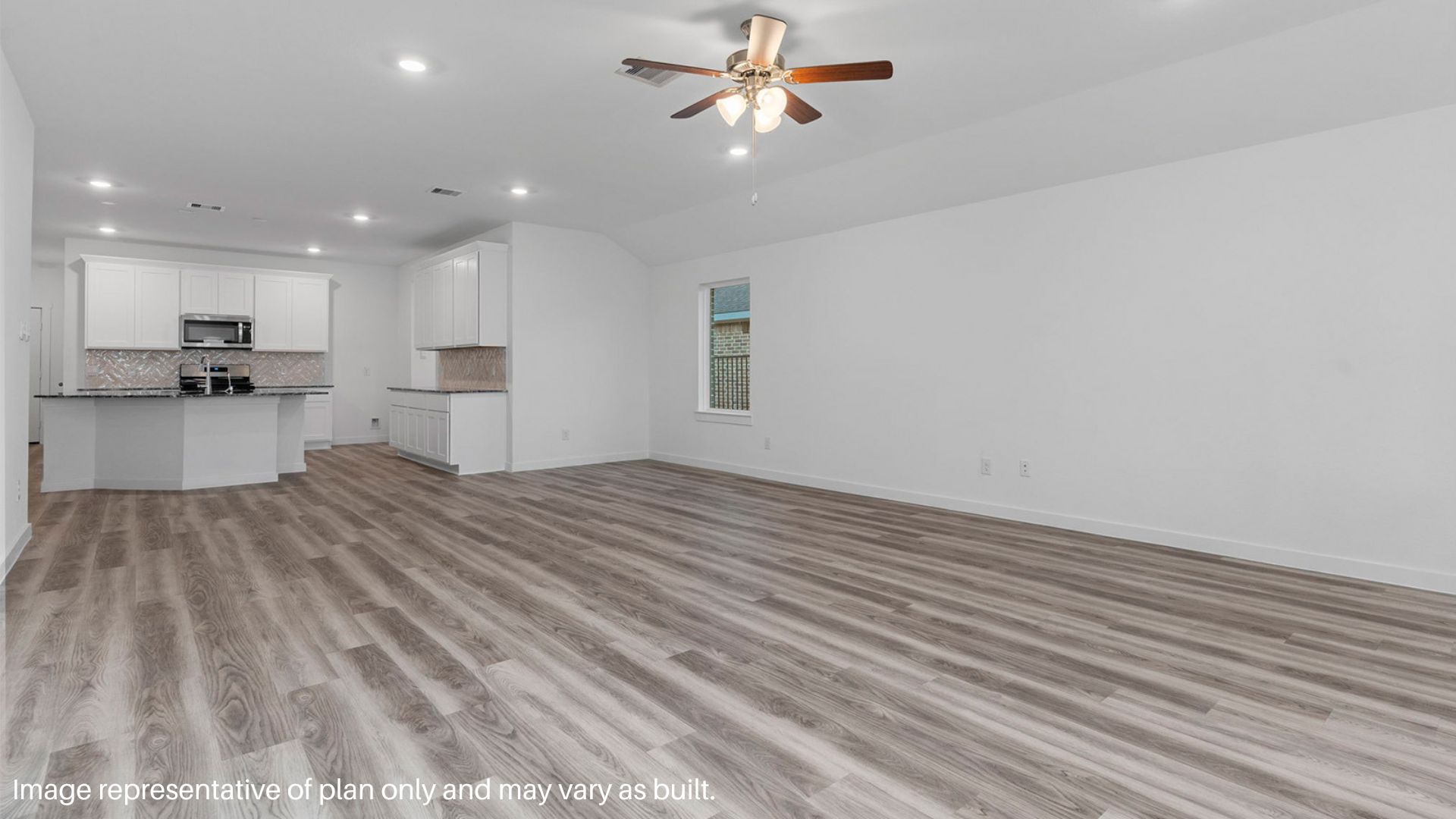 Spacious Living room with Large windows that bring in natural lighting