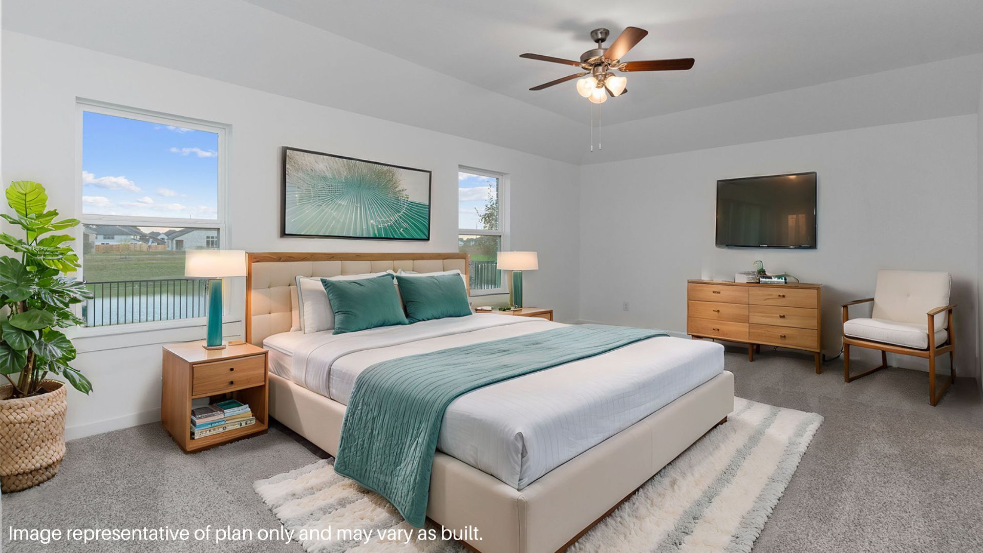 Primary bedroom with large windows.