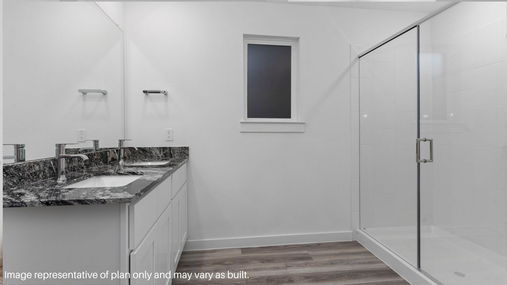 Double Vanity sink and Standing shower in the primary bathroom