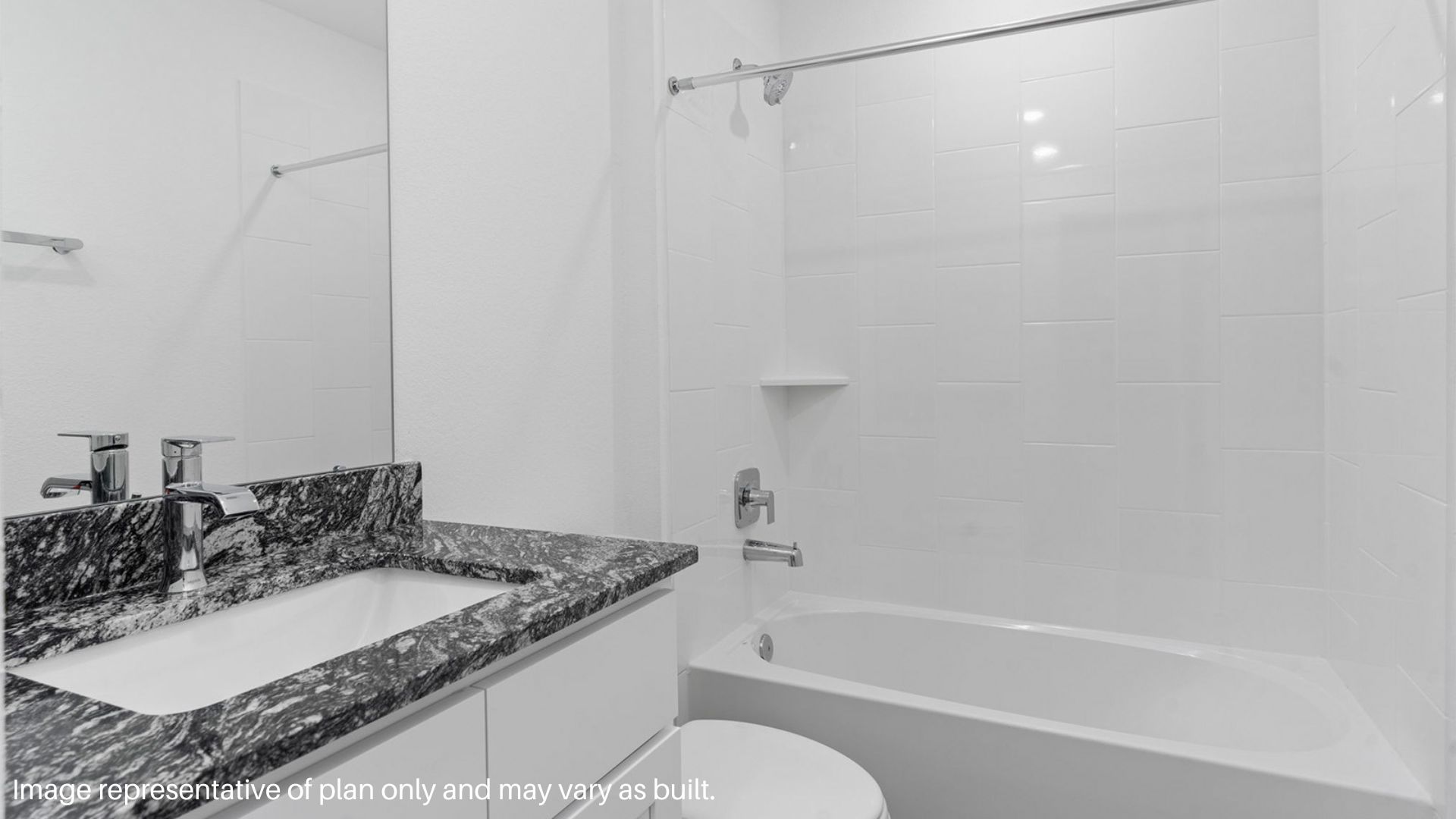 Secondary bathroom with sink and bathtub shower combo.