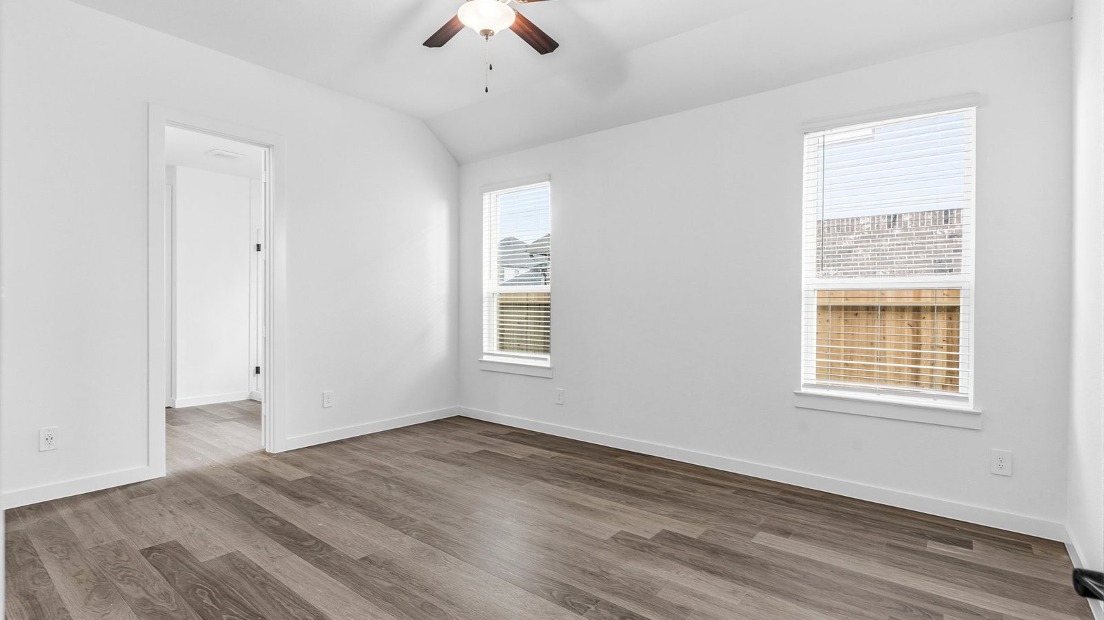 primary bedroom with two windows