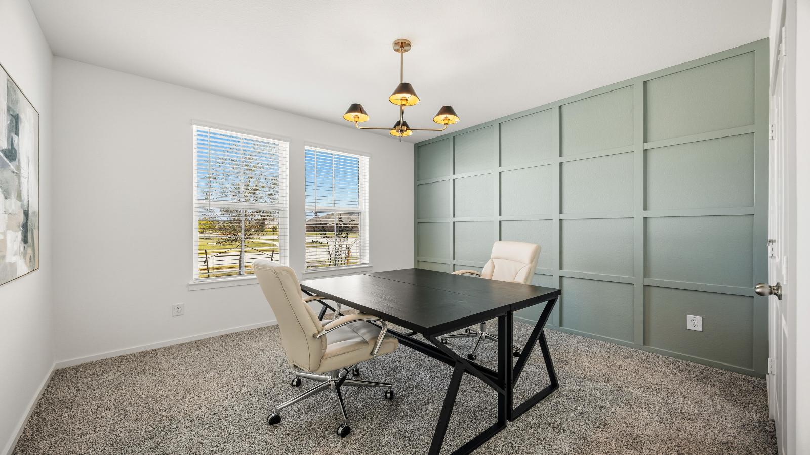 A tidy office featuring a desk, chair, and a window, creating a bright and organized workspace.