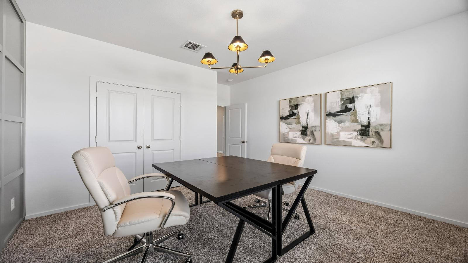 A tidy office featuring a desk, chair, and a window, creating a bright and organized workspace.