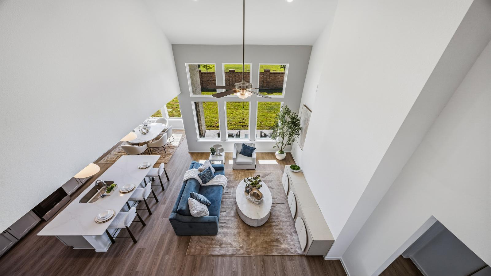 An aerial view of the living room from the second story balcony