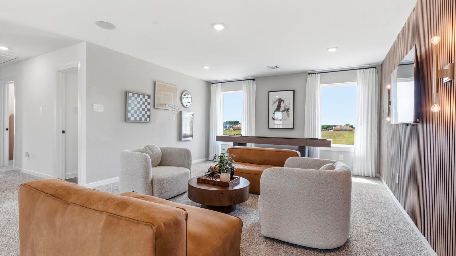 open concept game room with large windows