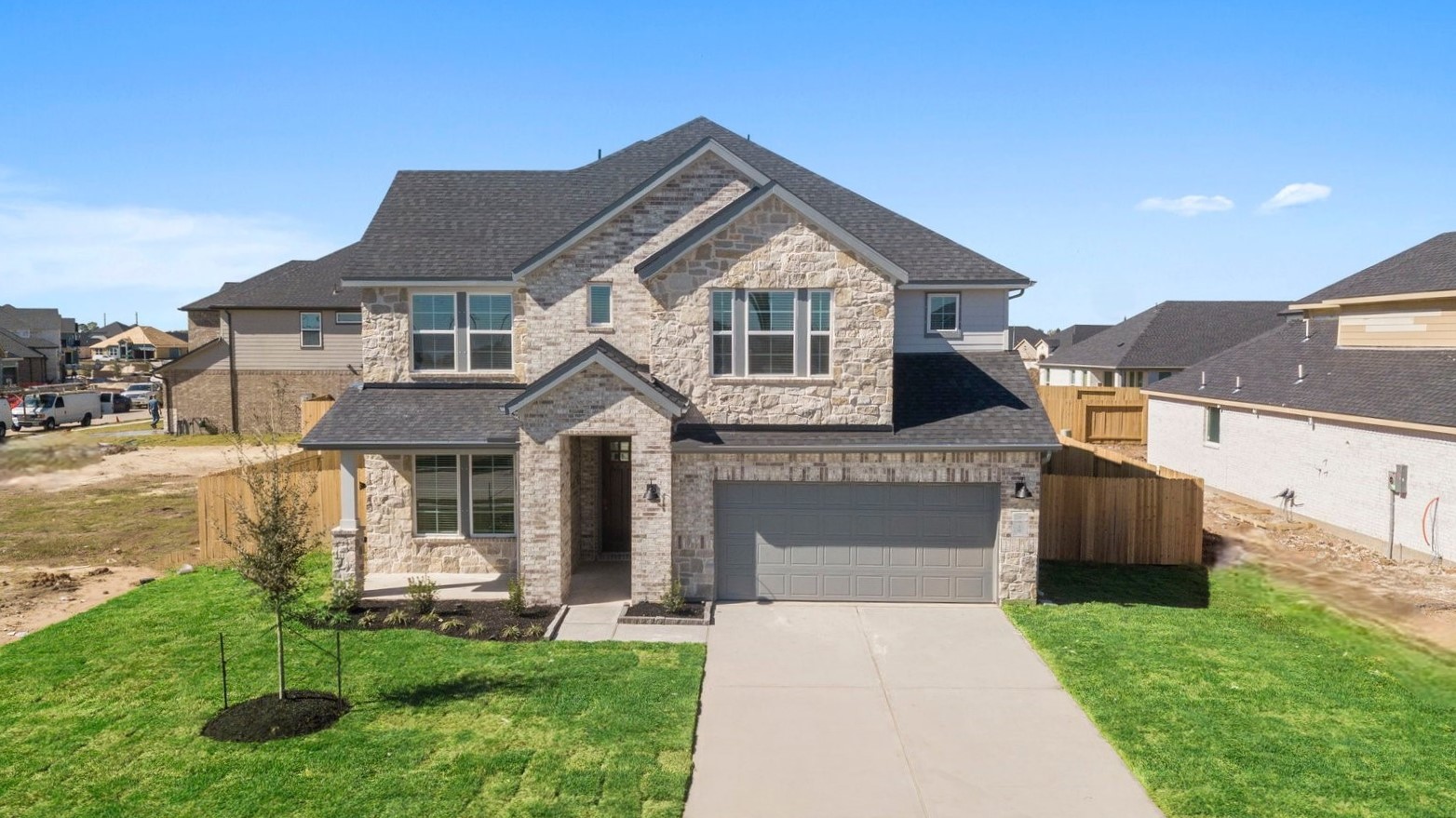 two story floor plan with brick and stone exterior