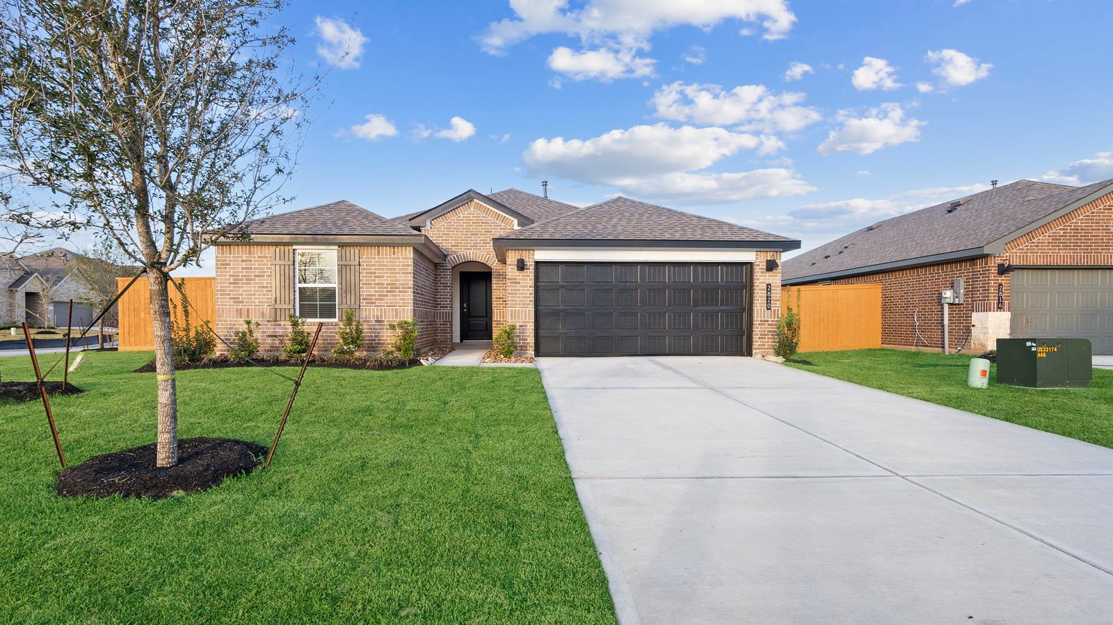 single story brick home with a two car garage