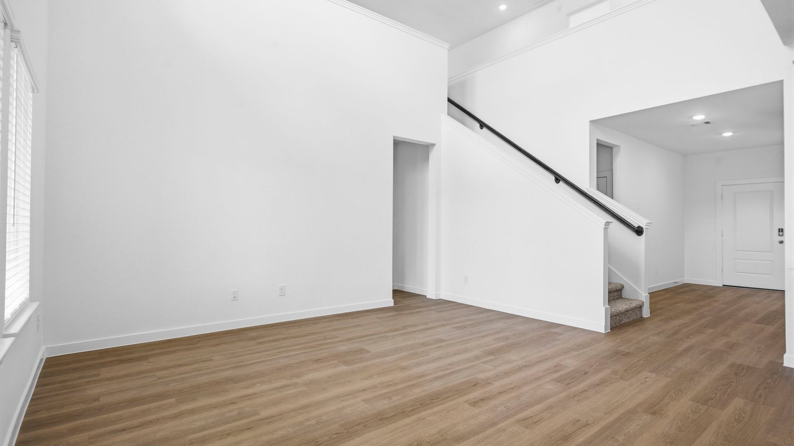 living room with tall ceilings and large windows