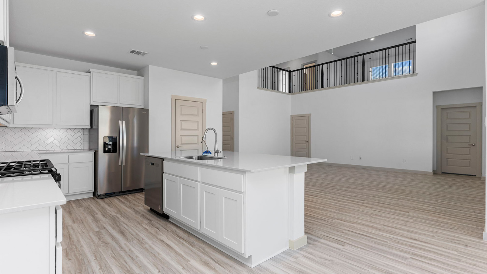 kitchen open to two story living room