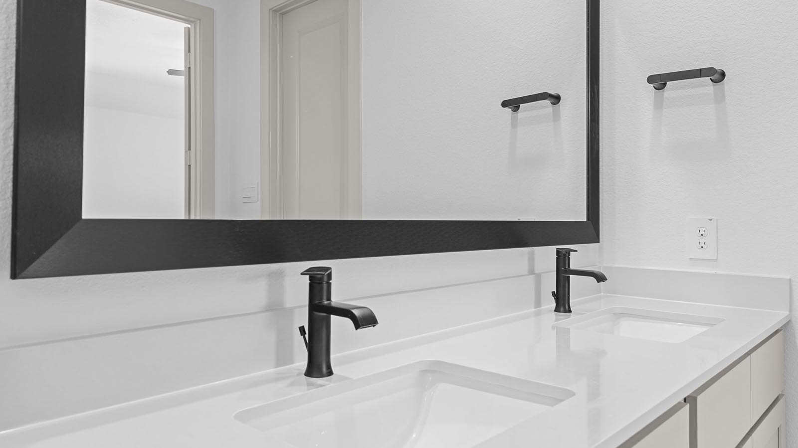 primary bathroom vanity with two sinks