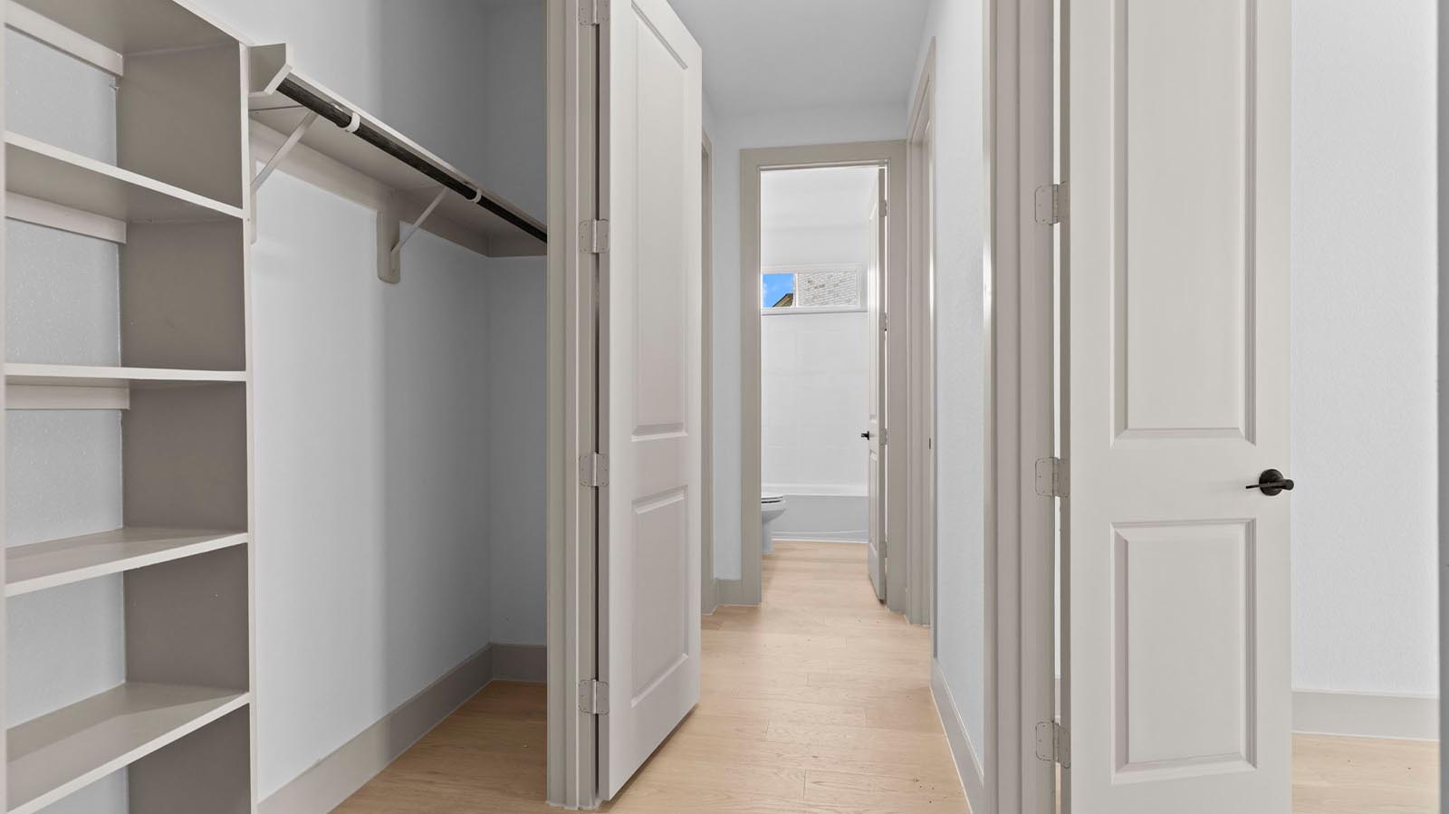 walk in primary closet with bult ins