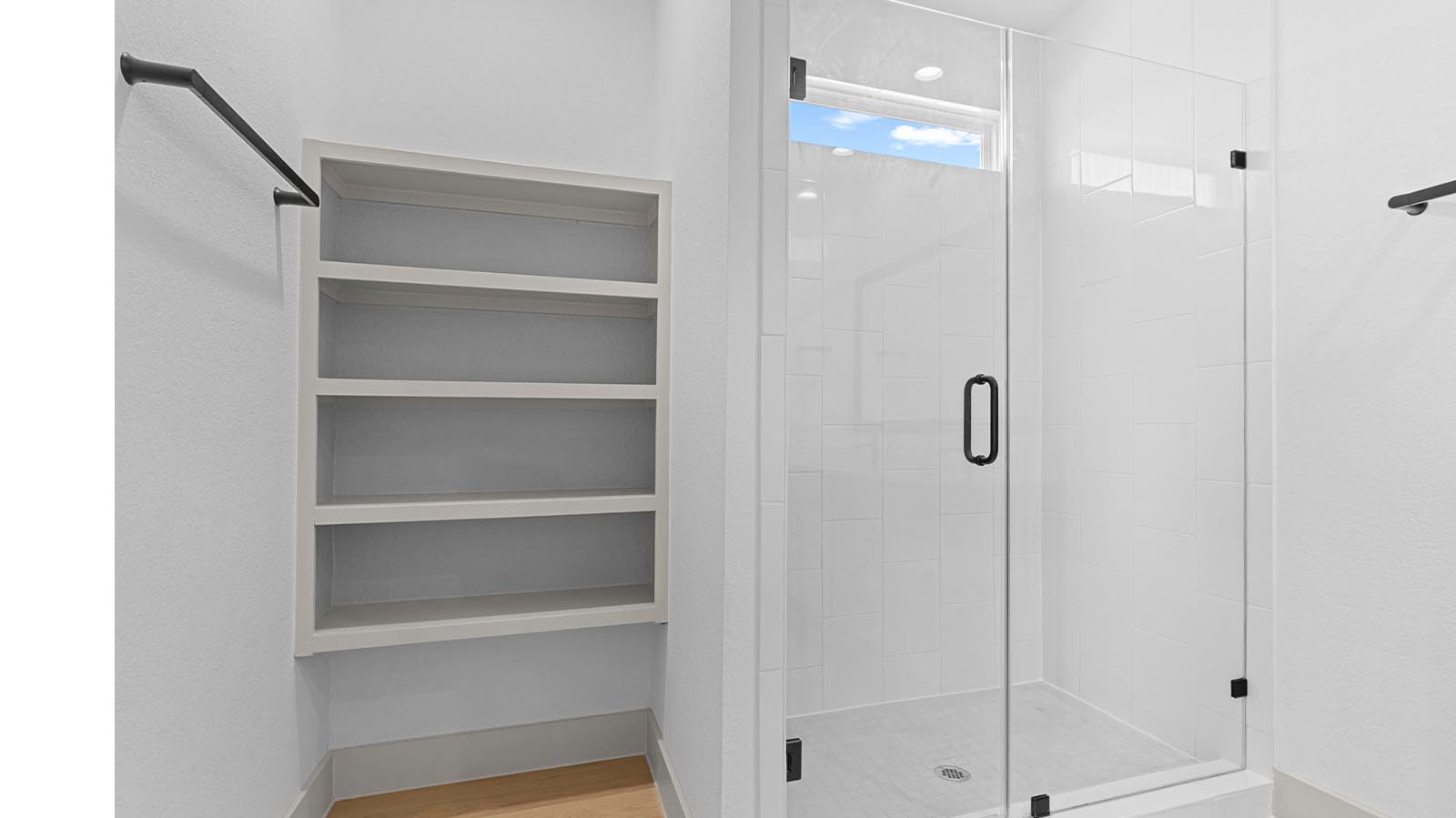 primary bathroom shower with glass framed shower