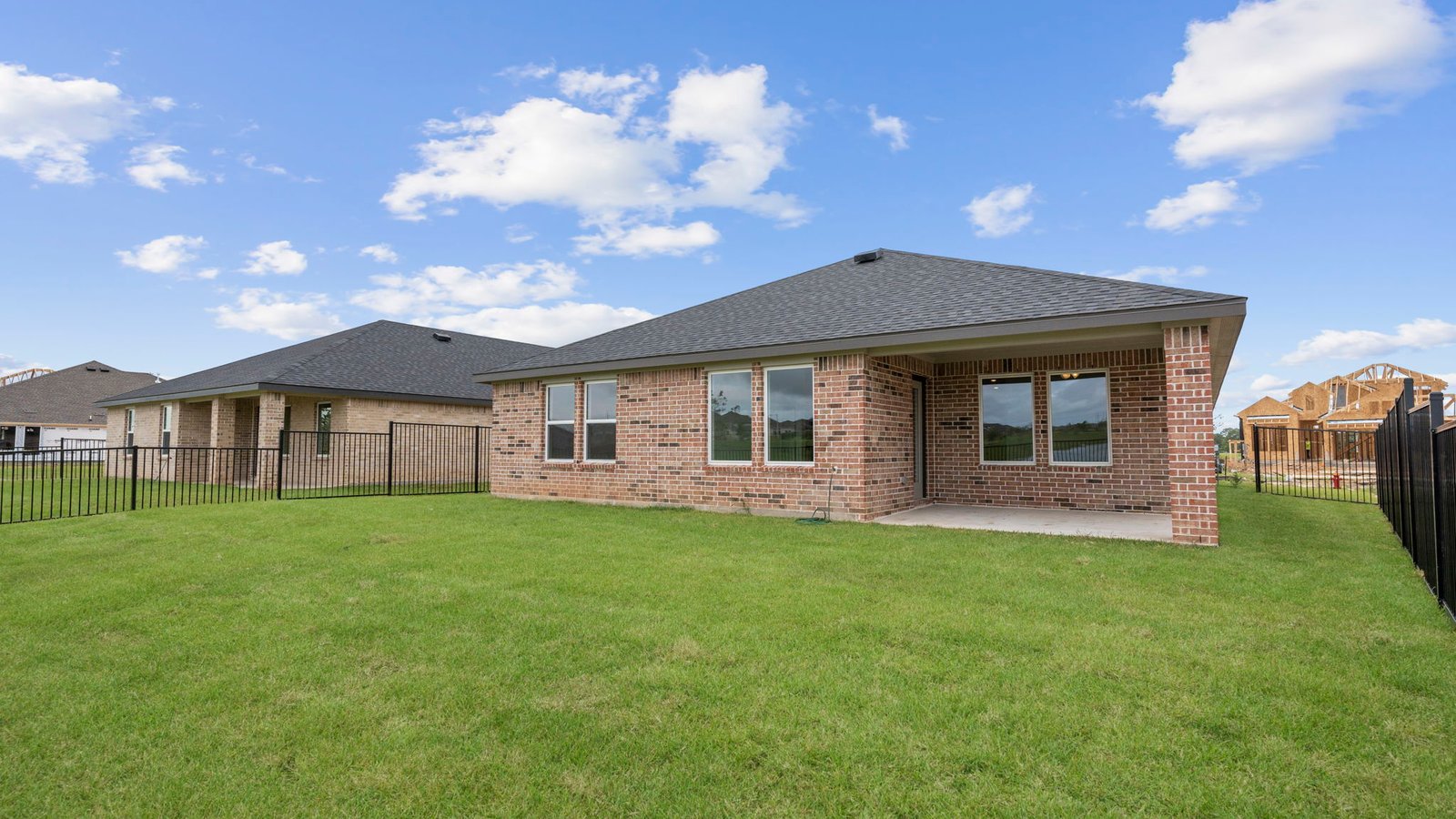 Large fenced-in backyard with a covered patio, perfect for outdoor entertaining.