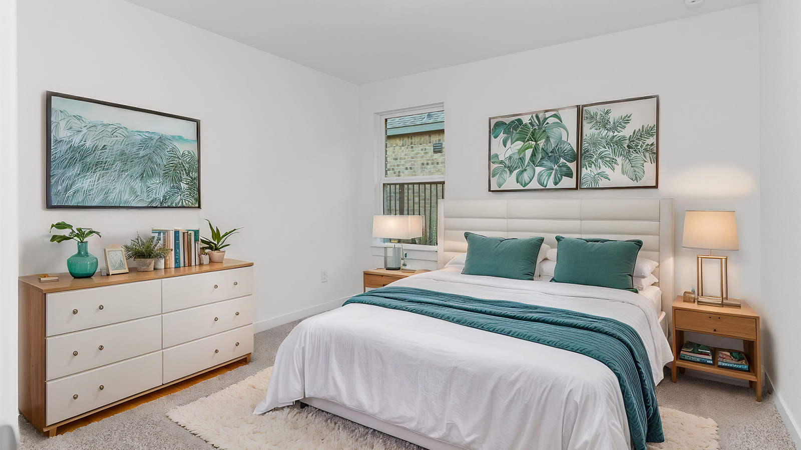 Comfortable guest bedroom featuring neutral-toned walls, carpeted flooring, and a separate closet.