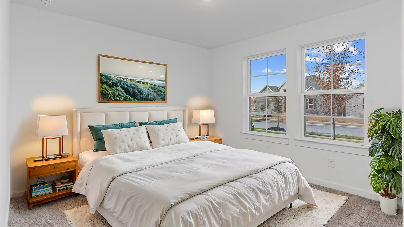 A third bedroom with neutral walls, plush carpet flooring and a separate closet.